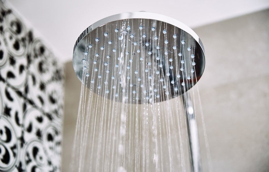 water-flowing-from-shower-head-in-bathroom-2023-11-27-04-49-17-utc.jpg